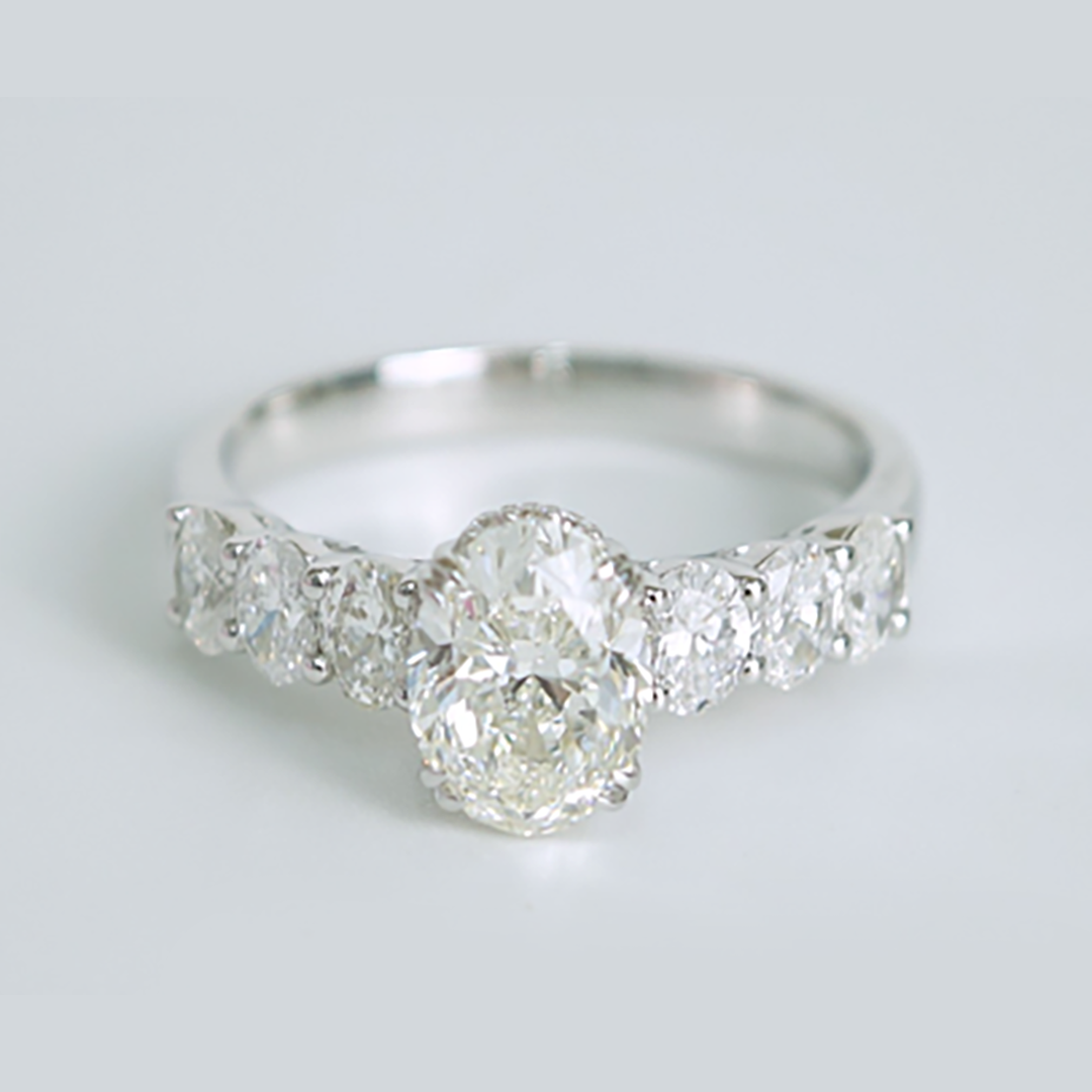 GIA-Certified Oval Diamond Three-Stone Ring in 18K White Gold